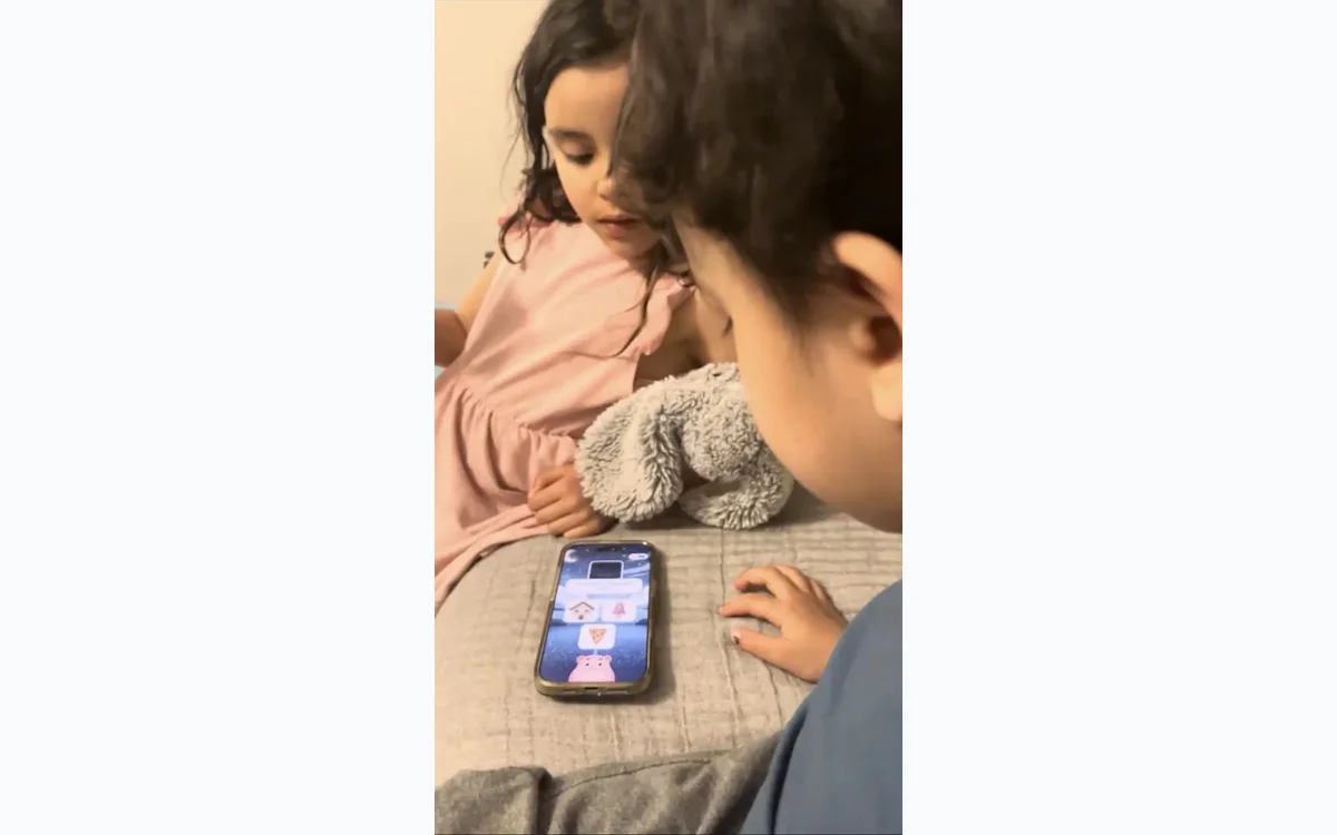 A parent and child using Ello's AI reading coach