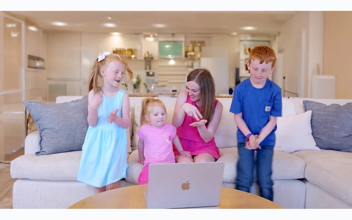 Family practicing a Learn How to Sign video lesson together