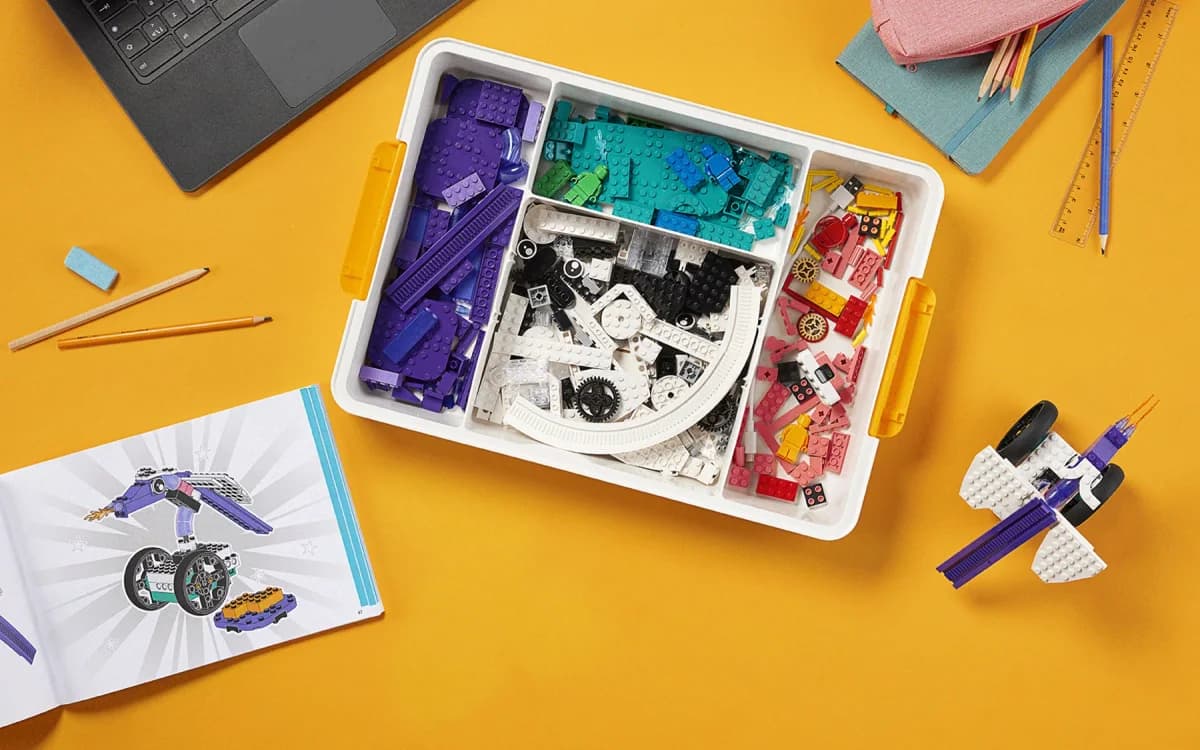Open LEGO Education Computer Science & AI kit and a laptop.