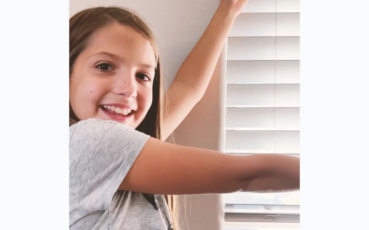 SkillTrek learner practicing home maintenance by installing blinds