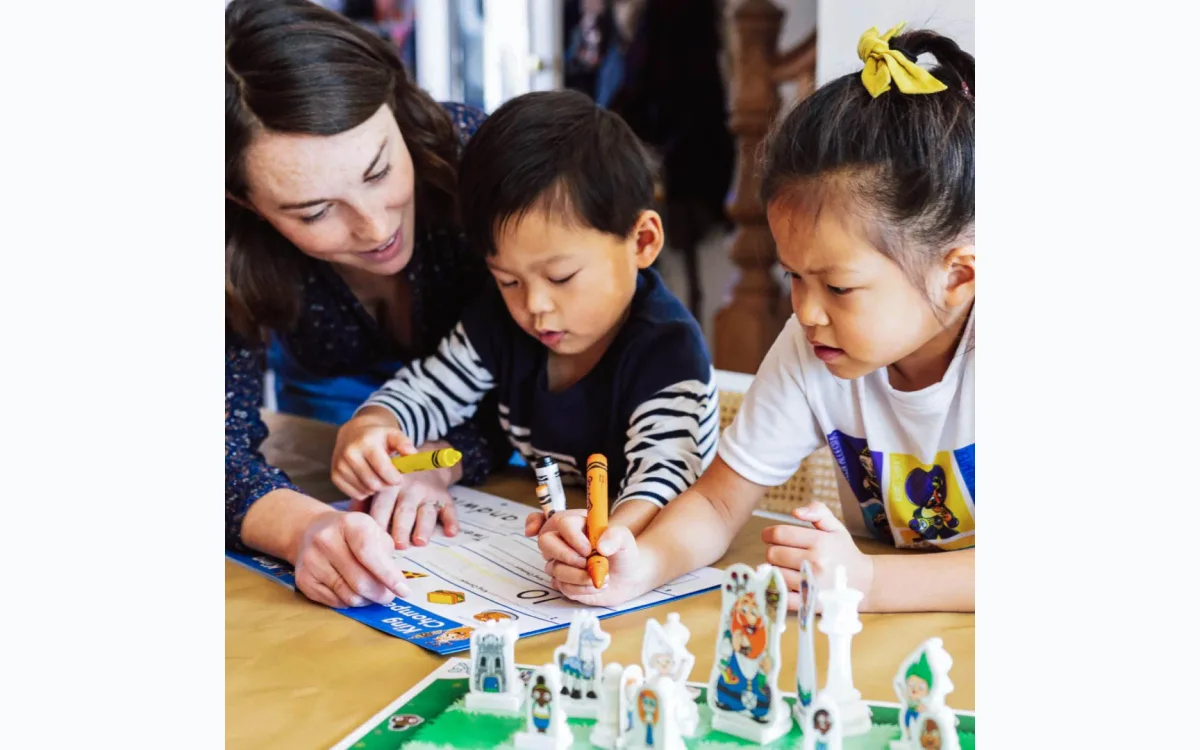 Child learning chess through interactive storytelling, improving critical thinking skills.